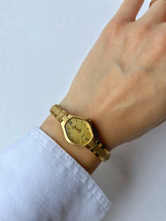 Gold tone watch