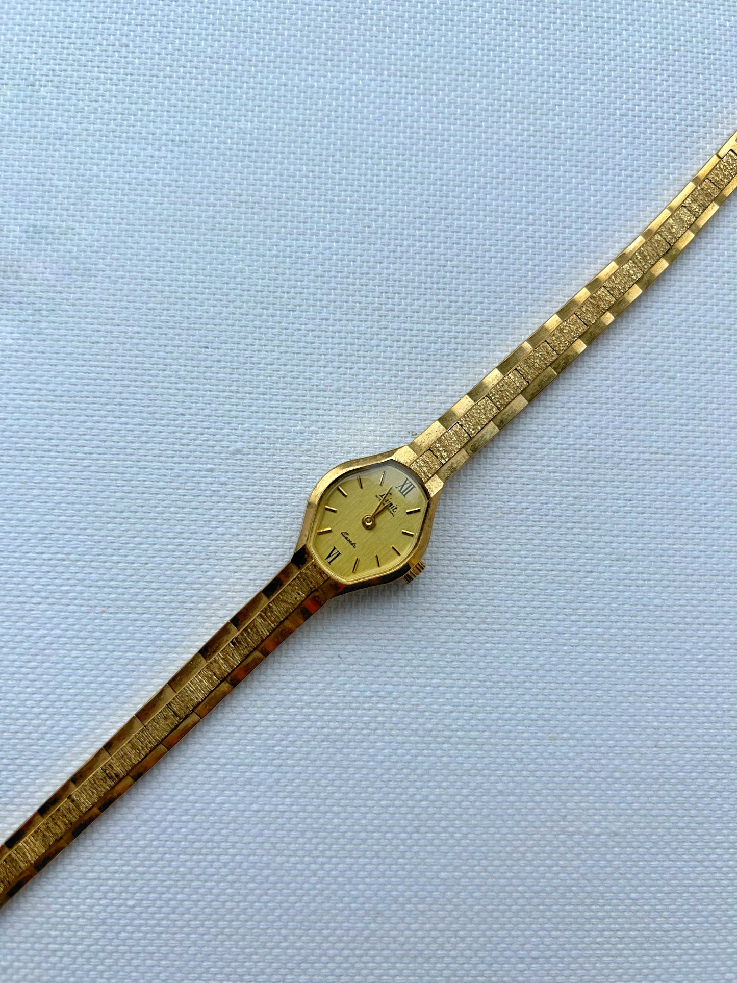 Gold tone watch